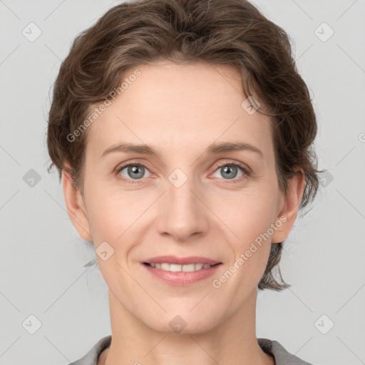 Joyful white young-adult female with short  brown hair and grey eyes