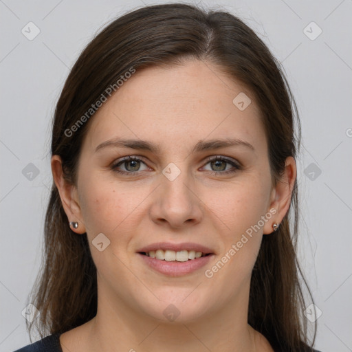 Joyful white young-adult female with long  brown hair and grey eyes