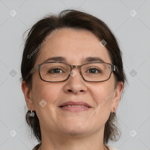 Joyful white adult female with medium  brown hair and brown eyes