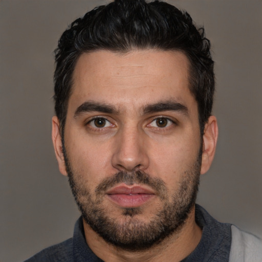 Neutral white young-adult male with short  black hair and brown eyes