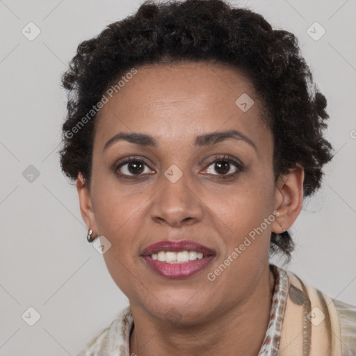 Joyful black adult female with short  brown hair and brown eyes