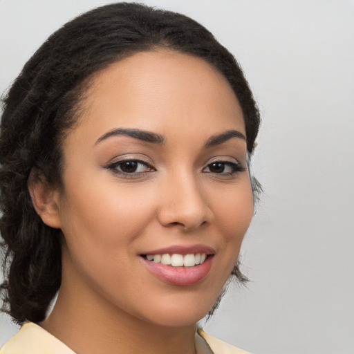 Joyful latino young-adult female with long  brown hair and brown eyes