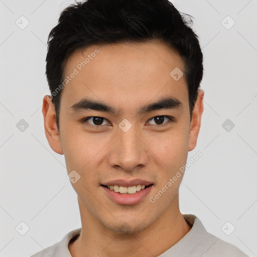 Joyful latino young-adult male with short  black hair and brown eyes