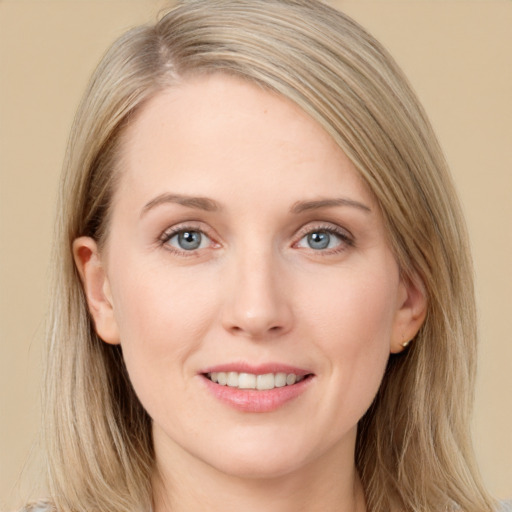 Joyful white young-adult female with long  brown hair and grey eyes