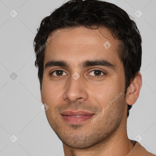 Joyful white young-adult male with short  black hair and brown eyes