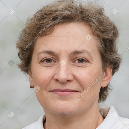 Joyful white adult female with short  brown hair and brown eyes