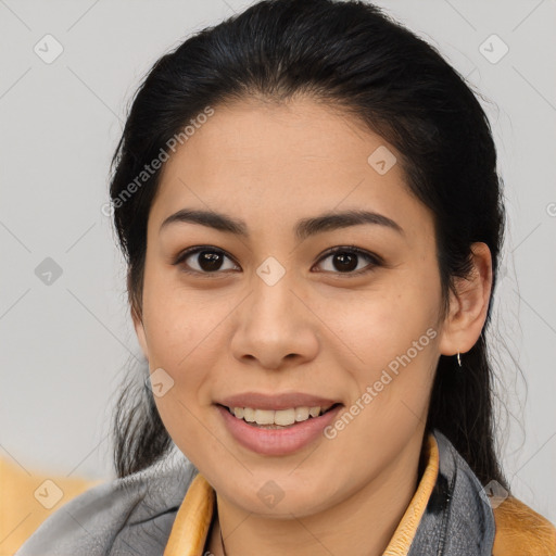 Joyful latino young-adult female with medium  brown hair and brown eyes