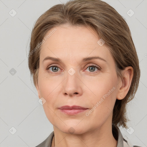 Joyful white adult female with medium  brown hair and grey eyes