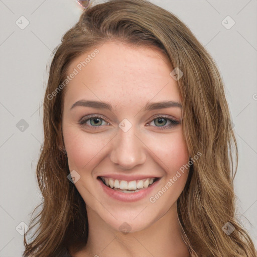 Joyful white young-adult female with long  brown hair and green eyes