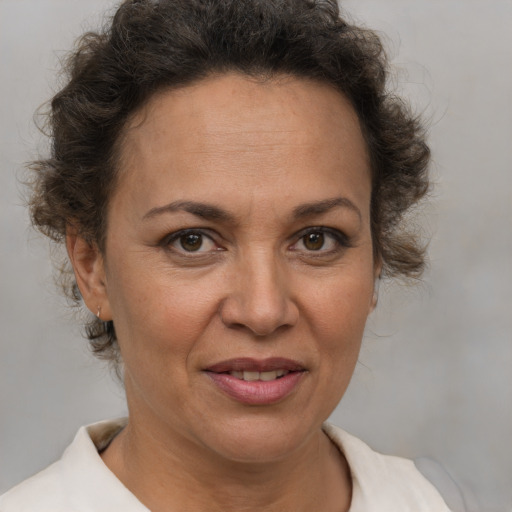 Joyful white adult female with short  brown hair and brown eyes