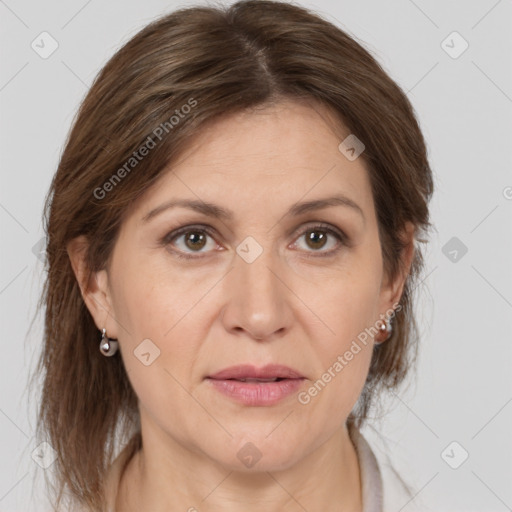 Joyful white adult female with medium  brown hair and brown eyes