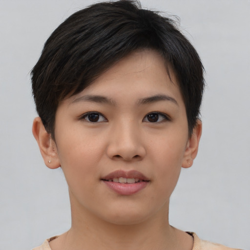 Joyful asian young-adult female with short  brown hair and brown eyes