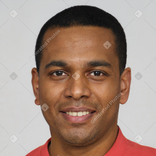 Joyful latino young-adult male with short  black hair and brown eyes