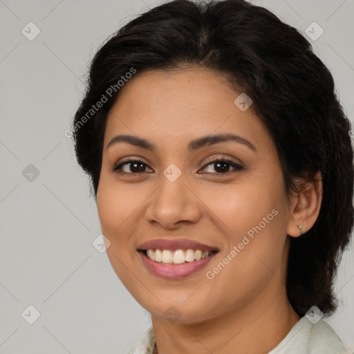 Joyful latino young-adult female with medium  brown hair and brown eyes