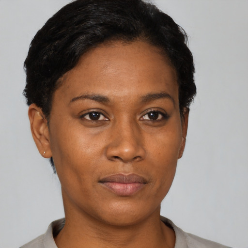 Neutral latino young-adult female with short  black hair and brown eyes