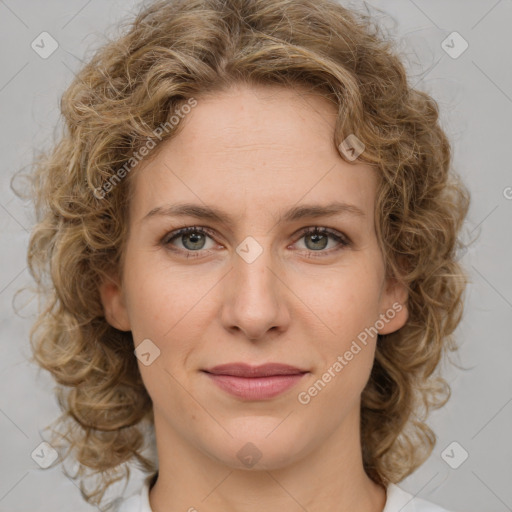 Joyful white young-adult female with medium  brown hair and green eyes