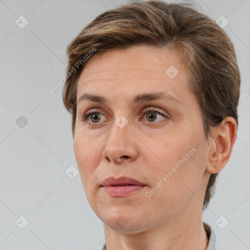 Joyful white adult female with short  brown hair and brown eyes