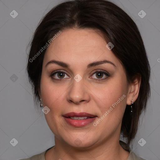 Joyful white adult female with medium  brown hair and brown eyes