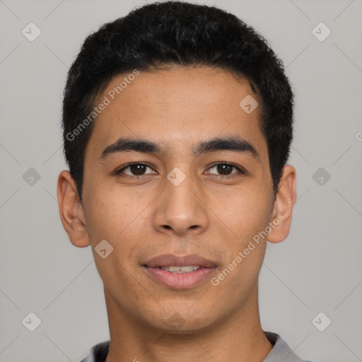 Joyful latino young-adult male with short  black hair and brown eyes