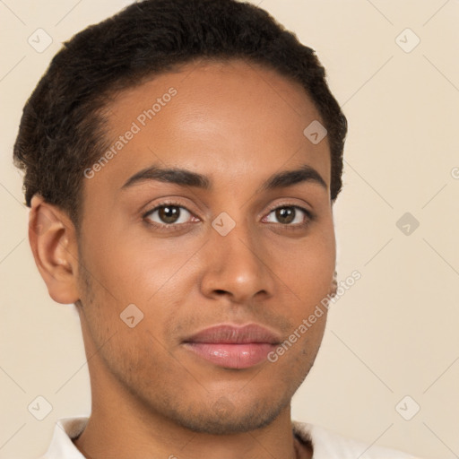 Joyful latino young-adult male with short  brown hair and brown eyes