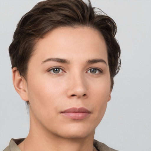 Neutral white young-adult female with short  brown hair and brown eyes