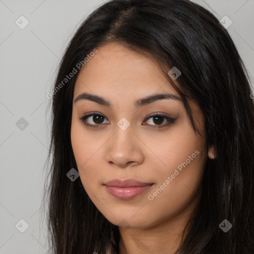 Joyful latino young-adult female with long  brown hair and brown eyes