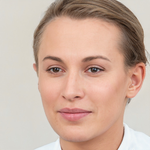 Joyful white young-adult female with short  brown hair and brown eyes