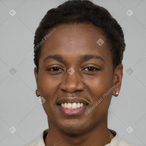 Joyful black young-adult female with short  black hair and brown eyes