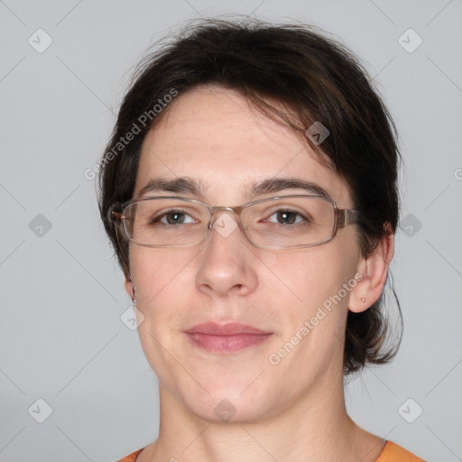 Joyful white adult female with medium  brown hair and brown eyes