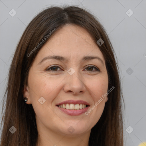 Joyful white adult female with long  brown hair and brown eyes