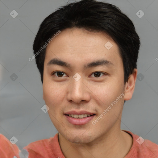 Joyful asian young-adult male with short  brown hair and brown eyes