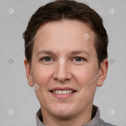 Joyful white adult female with short  brown hair and grey eyes