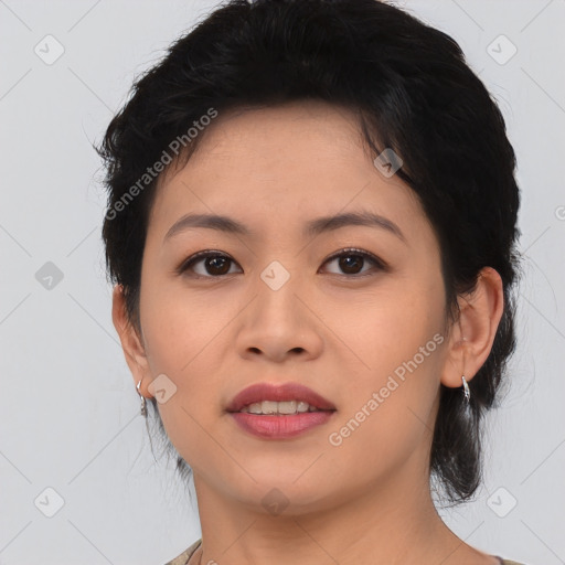 Joyful asian young-adult female with medium  black hair and brown eyes