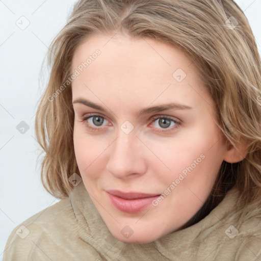 Joyful white young-adult female with long  brown hair and blue eyes