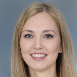 Joyful white young-adult female with long  brown hair and grey eyes