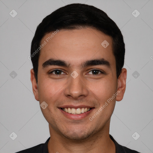 Joyful white young-adult male with short  black hair and brown eyes