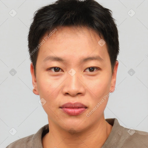 Joyful asian young-adult male with short  brown hair and brown eyes