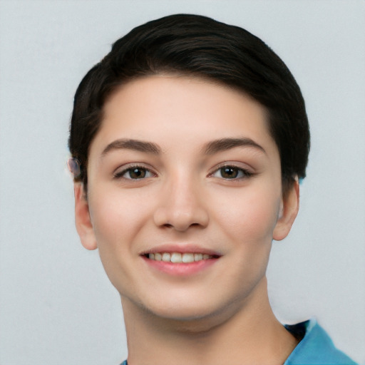 Joyful white young-adult female with short  black hair and brown eyes