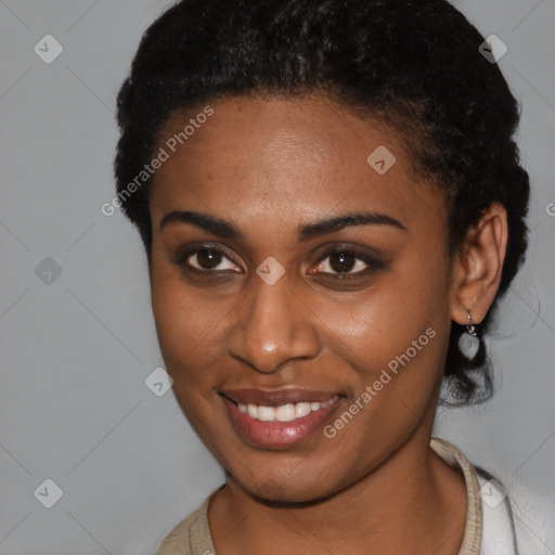 Joyful black young-adult female with short  brown hair and brown eyes