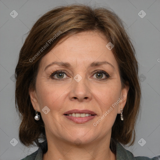 Joyful white adult female with medium  brown hair and blue eyes