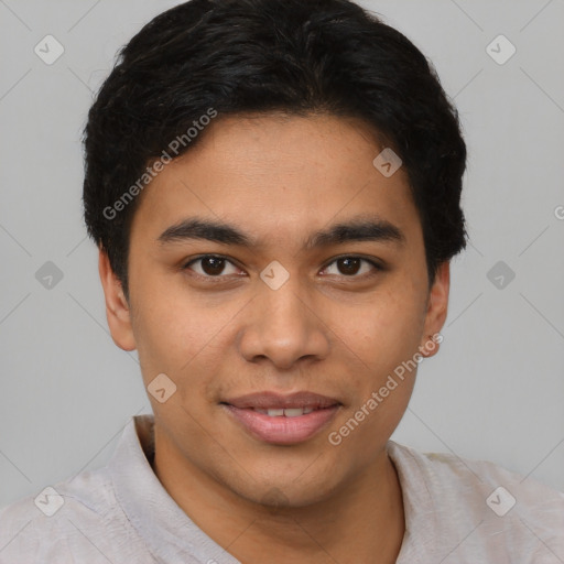 Joyful latino young-adult male with short  brown hair and brown eyes