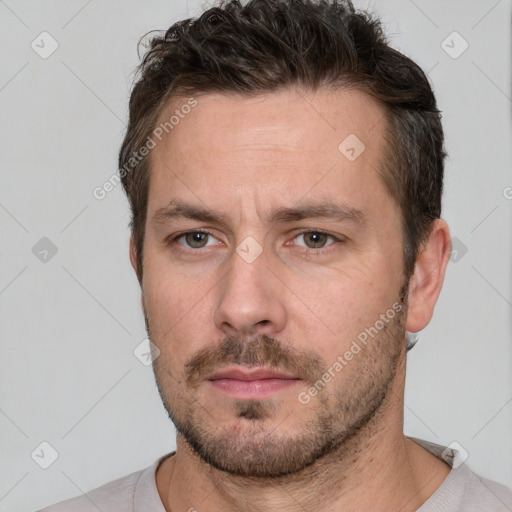 Neutral white adult male with short  brown hair and brown eyes