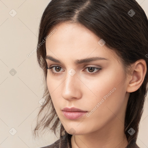 Neutral white young-adult female with long  brown hair and brown eyes