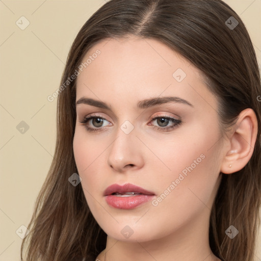 Neutral white young-adult female with long  brown hair and brown eyes