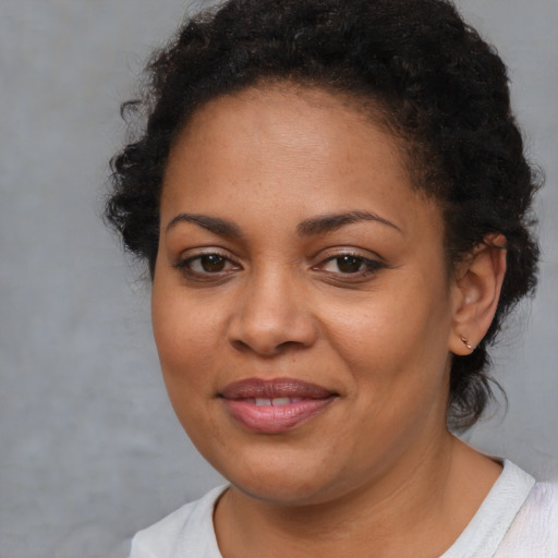Joyful latino young-adult female with short  brown hair and brown eyes