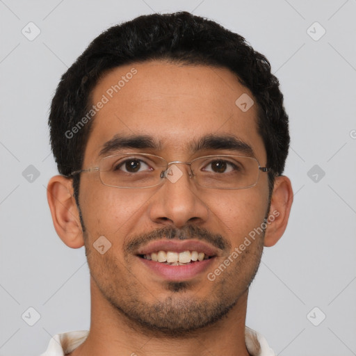 Joyful latino young-adult male with short  black hair and brown eyes