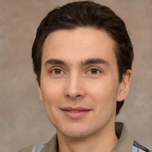 Joyful white young-adult male with short  brown hair and brown eyes