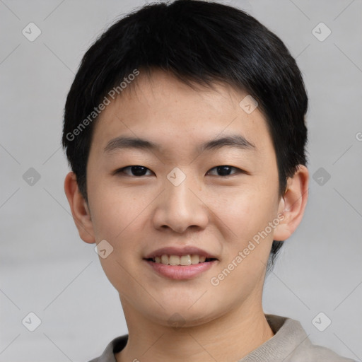 Joyful asian young-adult male with short  black hair and brown eyes