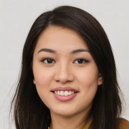 Joyful asian young-adult female with long  brown hair and brown eyes