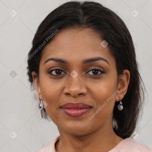 Joyful black adult female with medium  brown hair and brown eyes